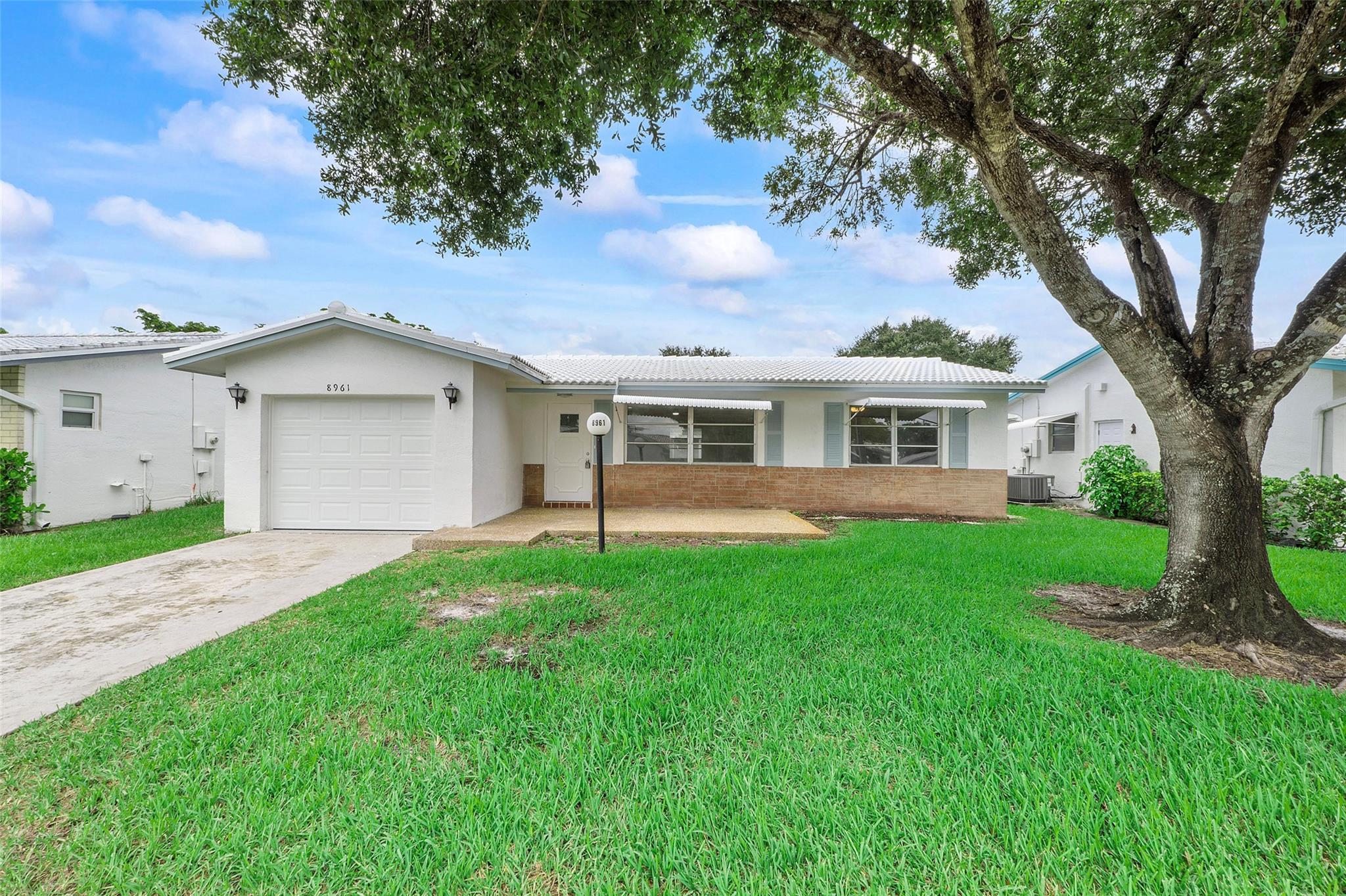 2024 ROOF , 2024 AC , 2024 Impact Garage door, New Kitchen ,New Bathrooms , New Stainless steel appliances, New porcelain tiled flooring and many more. Completely remodelled 2 Bed /2 Bath w/garage in a 55+ Community. The house has lot of open space and a large Florida room for entertainment. The garage has Epoxy flooring finish. Assoc. Fee Includes: Fiber Optic HDTV & Internet, Free community bus at your door, Lawn Service, Exterior painting, Huge Clubhouse, 2 Pools Tennis Courts, Pool Tables, Ping Pong, Card rooms, Professional Shows, Fitness Center & more! Buyer to be pre-approved by seller's prefered lender. Easy to show , vacant on Lock Box.