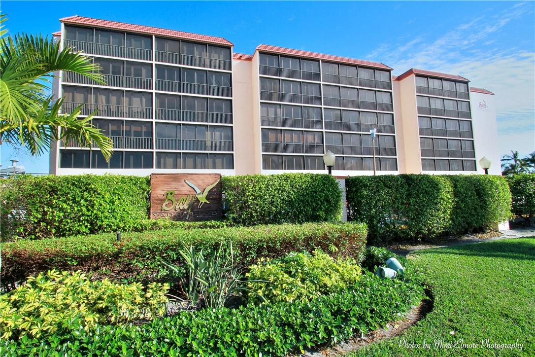 Charming Corner Unit in Bay Yacht Club Discover this updated 1-bedroom, 1-bath corner unit in the desirable Bay Yacht Club community. Featuring an open, modern kitchen and tiled floors throughout, this home offers a bright, airy feel. Enjoy the spacious, glass-enclosed balcony—perfect for a den or home office. The unit comes with a separate storage space for added convenience, along with one assigned parking spot and ample guest parking. Community amenities include a heated pool and barbeque area overlooking Lake Santa Barbara, a fully equipped exercise room, and a club room for social events. Pet-friendly (one pet up to 25 lbs) and just moments from the beach, shops, and dining. This is a must-see property!