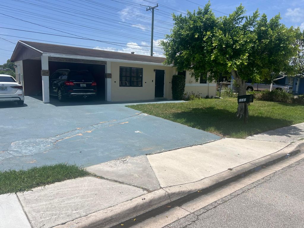 Photo of 1131 W 1st Street, Riviera Beach, FL 33404 (MLS # B26052576)