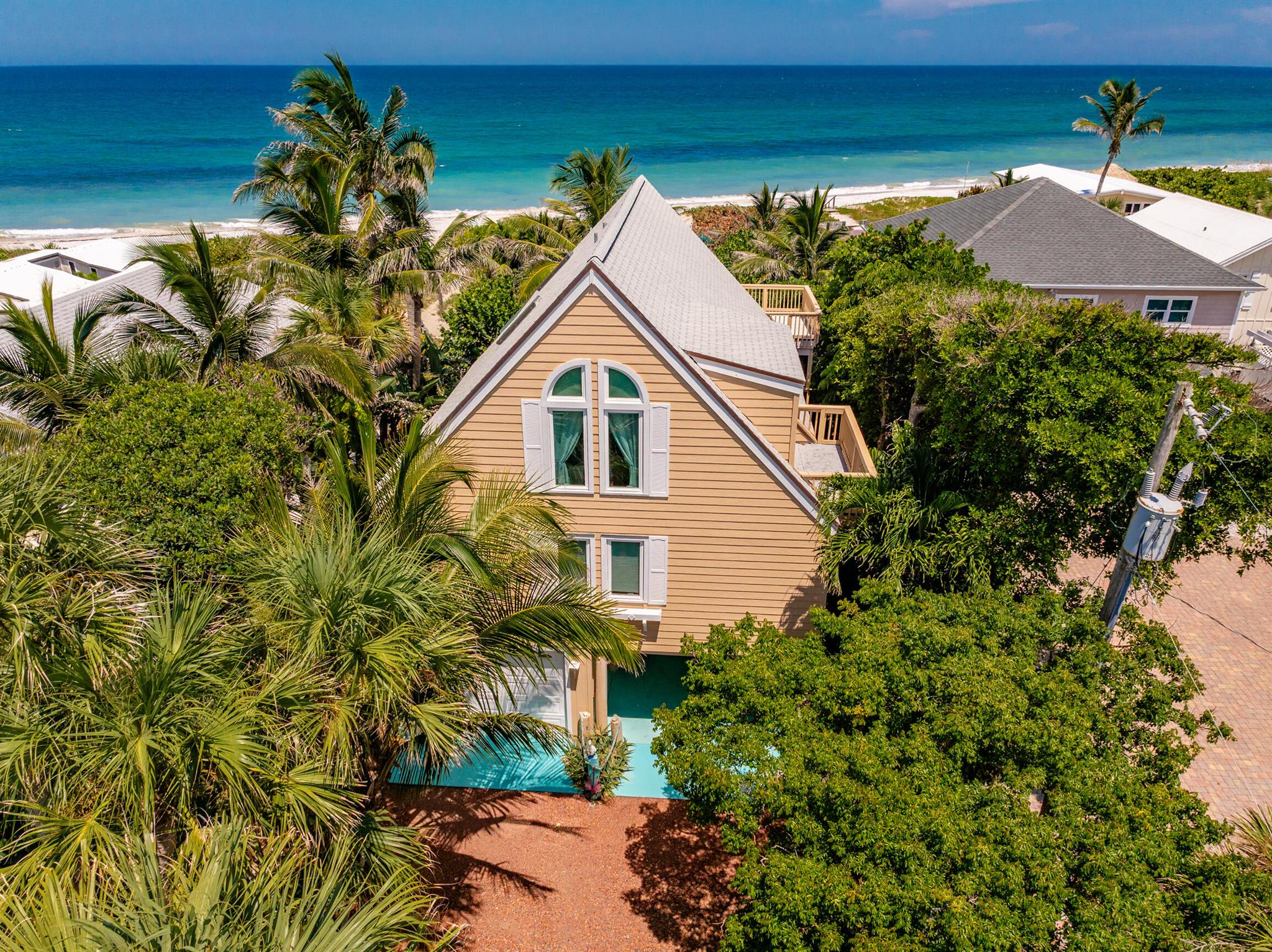 Treasure Hunter's Dream! Ocean-to-River Rustic Beach RetreatDiscover the magic of true coastal living in this one-of-a-kind 3-bedroom, 2-bath oceanfront beach house with dual waterfronts! Nestled on a rare property that touches both the ocean and the river, this rustic A-frame retreat offers the ultimate escape.Wake up to serene sunrises over the Atlantic, enjoy quiet walks on your private ocean beach, and finish the day with spectacular sunsets over the river. With soaring ceilings, timeless charm, and tons of natural light, this home was made for relaxation and adventure.Bring your kayaks, build a dock, and enjoy everything this incredible location has to offer. Whether it's a family getaway, vacation rental, or dream home, this property is a true treasure.