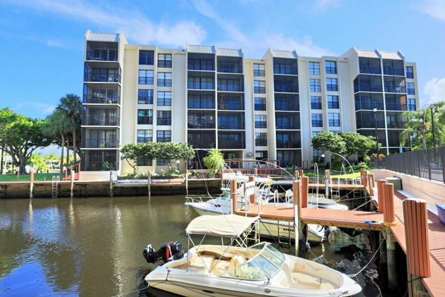 Breathtaking panoramic water views from this second story totally renovated corner unit overlooking the Hillsboro Canal, the pool and marina and lush vegetation. A complete renovation of this gorgeous bright and airy condo has just been  completed. This open floor plan has new tile floors and stainless steel appliances; granite countertops; smooth ceilings; modern lighting fixtures; and a WASHER AND DRYER! This is truly like living in a brand new condo, tastefully designed for premier Florida living. This building is situated in a very private corner of the property and it is like living in your own tropical retreat. Hurry, it will not last!