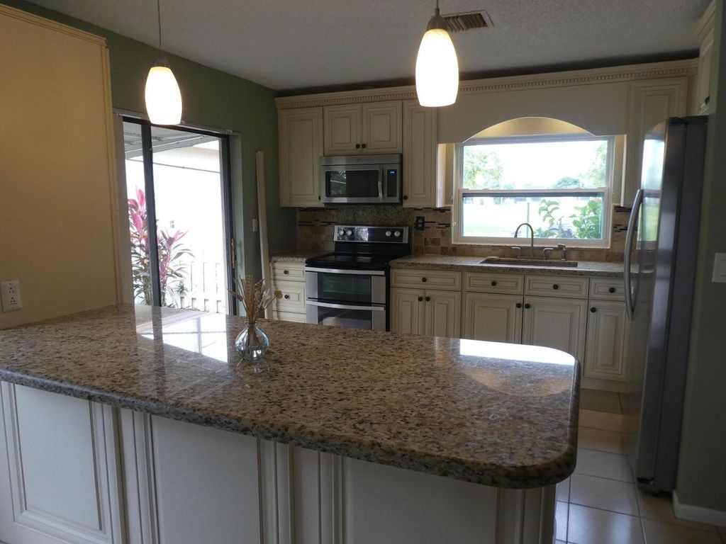 Photo of 5751 Mirror Lakes Boulevard, Boynton Beach, FL 33472 (MLS # R11132866)