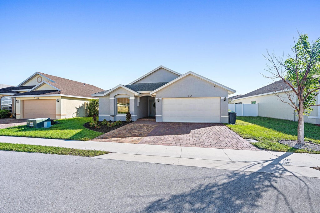 Photo of 312 PALM BREEZES Drive, Fort Pierce, FL 34945 (MLS # B26081613)