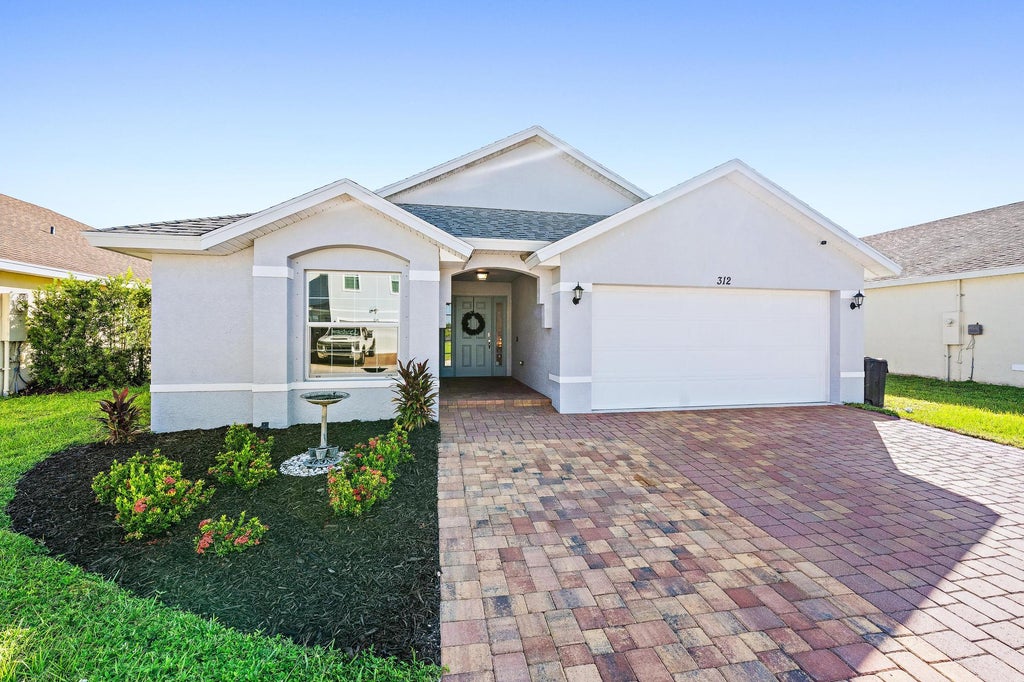 Photo of 312 PALM BREEZES Drive, Fort Pierce, FL 34945 (MLS # B26081613)