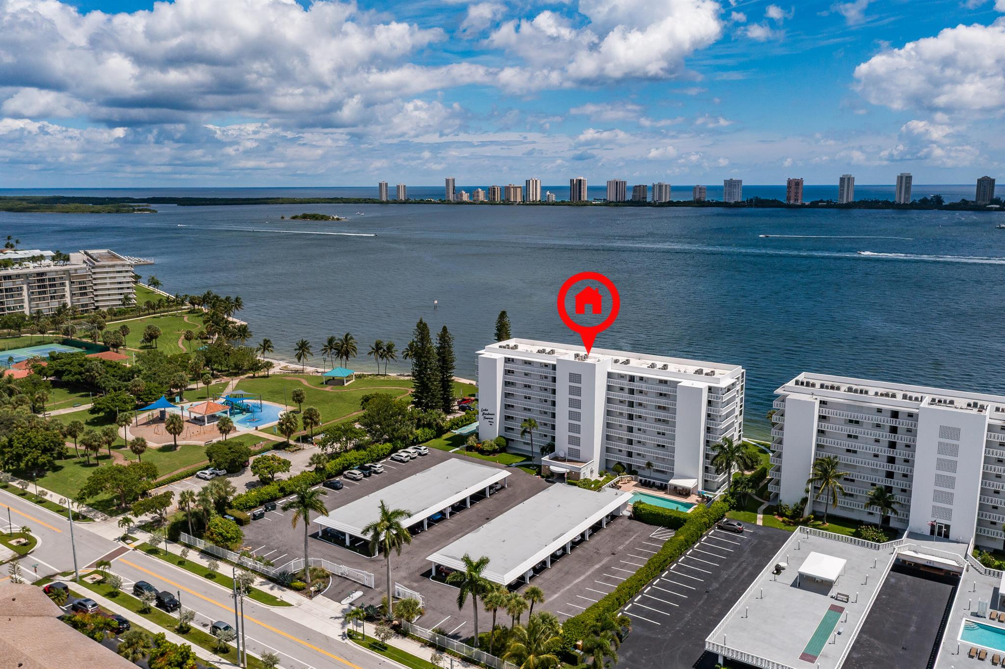 Wow is what you will say when you walk in and see the view, This 2-bedroom, 2-bath condo directly on the Intracoastal is in a gated community with 1 covered parking space. The interior feels bright and inviting with fresh paint throughout and new grout in kitchen and bathrooms. Kitchen has LG Appliances, and extra cabinets/counters, The upgraded second bathroom adds a touch of modern style, while the expansive balcony with its new epoxy floor invites you to relax and take in endless water views.The community is was recently pressure washed and very clean. This condo is a move-in-ready retreat. You will feel pride of ownership (including all new outlets and switches). This residence is the perfect blend of comfort, convenience, with relaxed waterfront lifestyle.