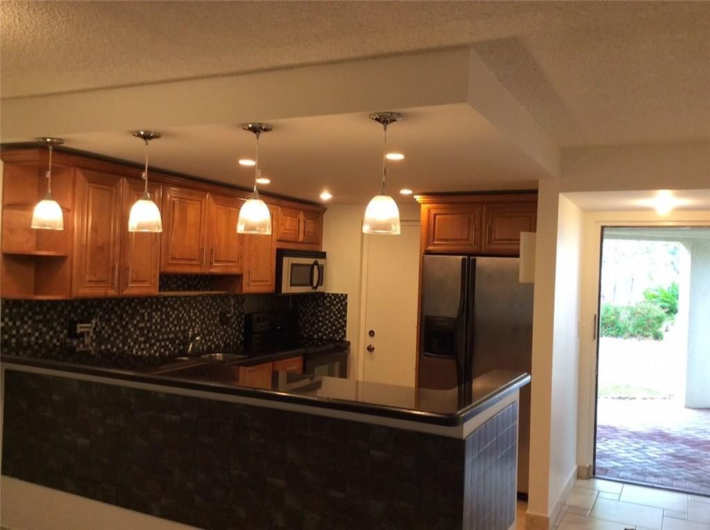 Photo of 2313 S Cypress Bend Drive #122B, Pompano Beach, FL 33069 (MLS # F10410050)