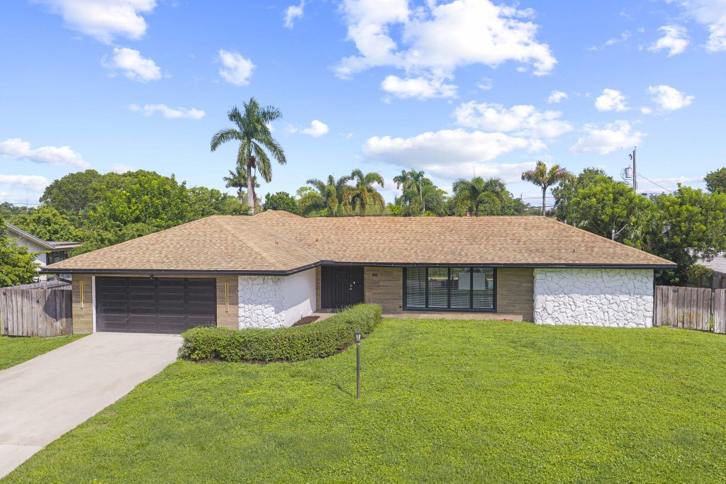 Photo of 80 W RUBBER TREE Drive, Lake Worth, FL 33467 (MLS # B26087901)
