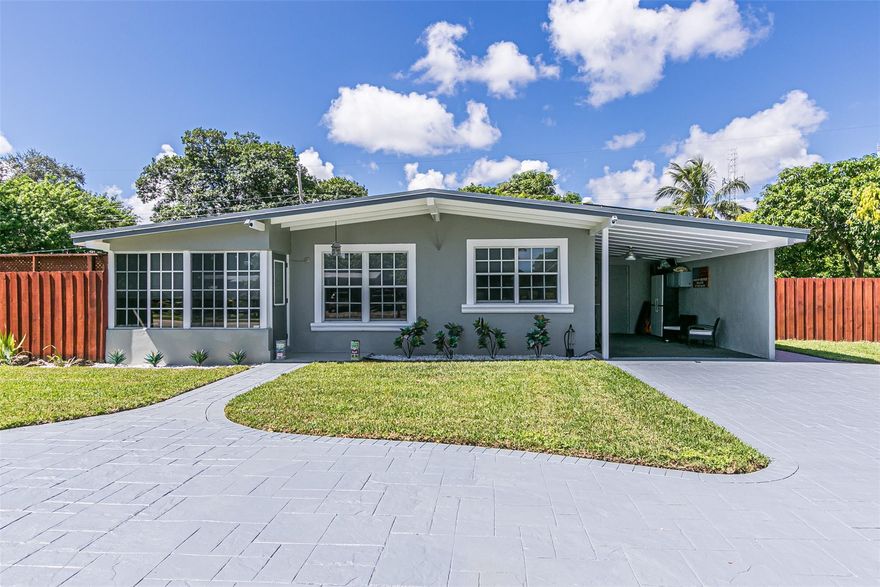 No HOA!  Perfect for Air BNB or family! Brand New Roof 2023! Solar Panels run all electrical. 2 bedrm +den 2 full baths. New irrigation, pump  & sod. New luxury vinyl floors. Den w/ barn door and french doors. Great space for home office/add'l guest room. Private fenced yard w/ new SWIM spa w/ warranty.  Newly renovated kitchen w/ rolling Island, quartz counter tops ,tiled backsplash & modern cabinetry. HUGE U shaped yard w/ picnic area to convey. 2/3 pavers and large side yard w/ new sod. 2nd bed set up as in law/studio. Bring boat/RV. New painted ext. & interior. A/C 6 years new. Storage shed. Circular driveway & Carport w/ utility/ laundry room. PGT Windows. Room for pool. You will love this homes curb appeal. Pride of ownership. A few blocks to US1 & Approx 2 miles to Deerfield Beach.