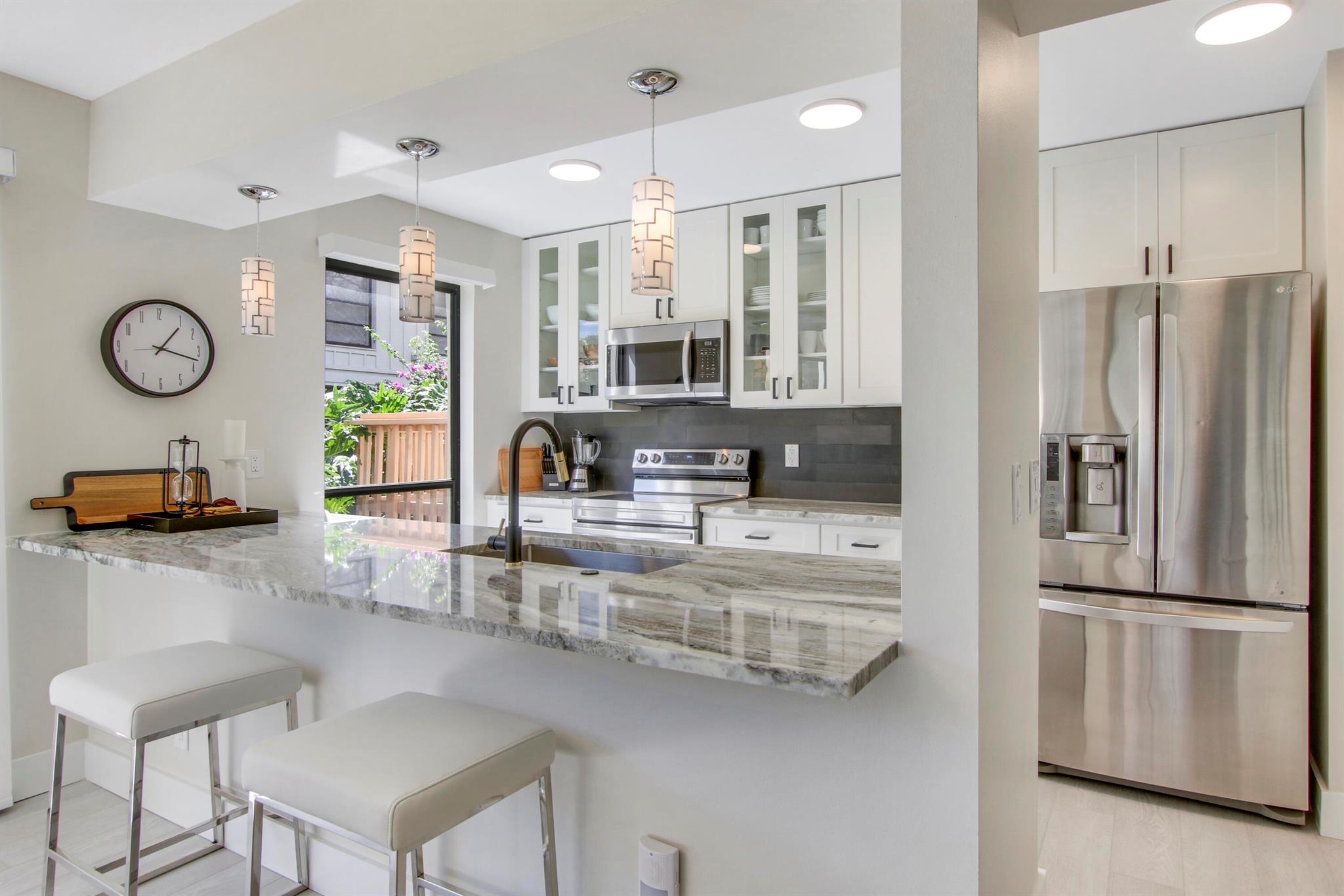Rates: December 2025 $7000, Jan 2026 $12,000, Feb 2026 $14,000, Mar and Apr $12,00. Great care has been taken in ensuring that this beautiful condo is prepared for your ultimate comfort and enjoyment. Step into luxury wood-look flooring throughout. Stunning new quartz kitchen countertops with a stainless steel sink and faucet. The unit is elegantly decorated with a modern relaxing style and furnished to sleep 4 with a guest room that can be arranged with two twin beds or a single king sized bed. Sip your morning coffee from the fully screened lanai which overlooks tranquil water. Not available for subletting.