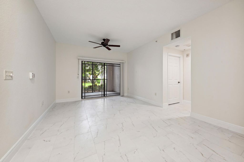 Photo of 3021 Alcazar Place #104, Palm Beach Gardens, FL 33410 (MLS # R11001017)