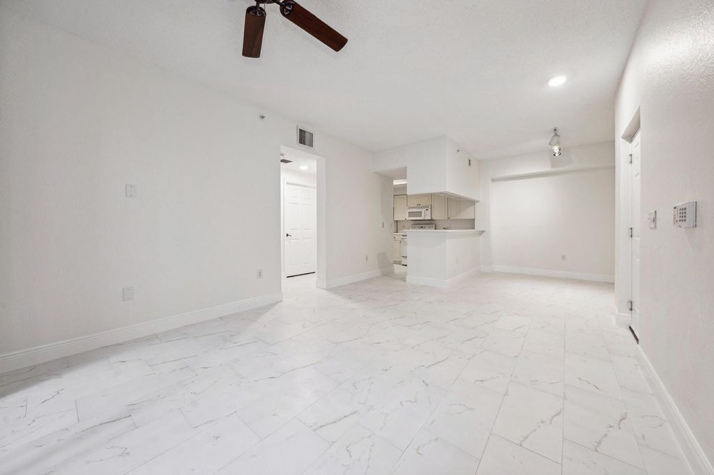 Photo of 3021 Alcazar Place #104, Palm Beach Gardens, FL 33410 (MLS # R11001017)
