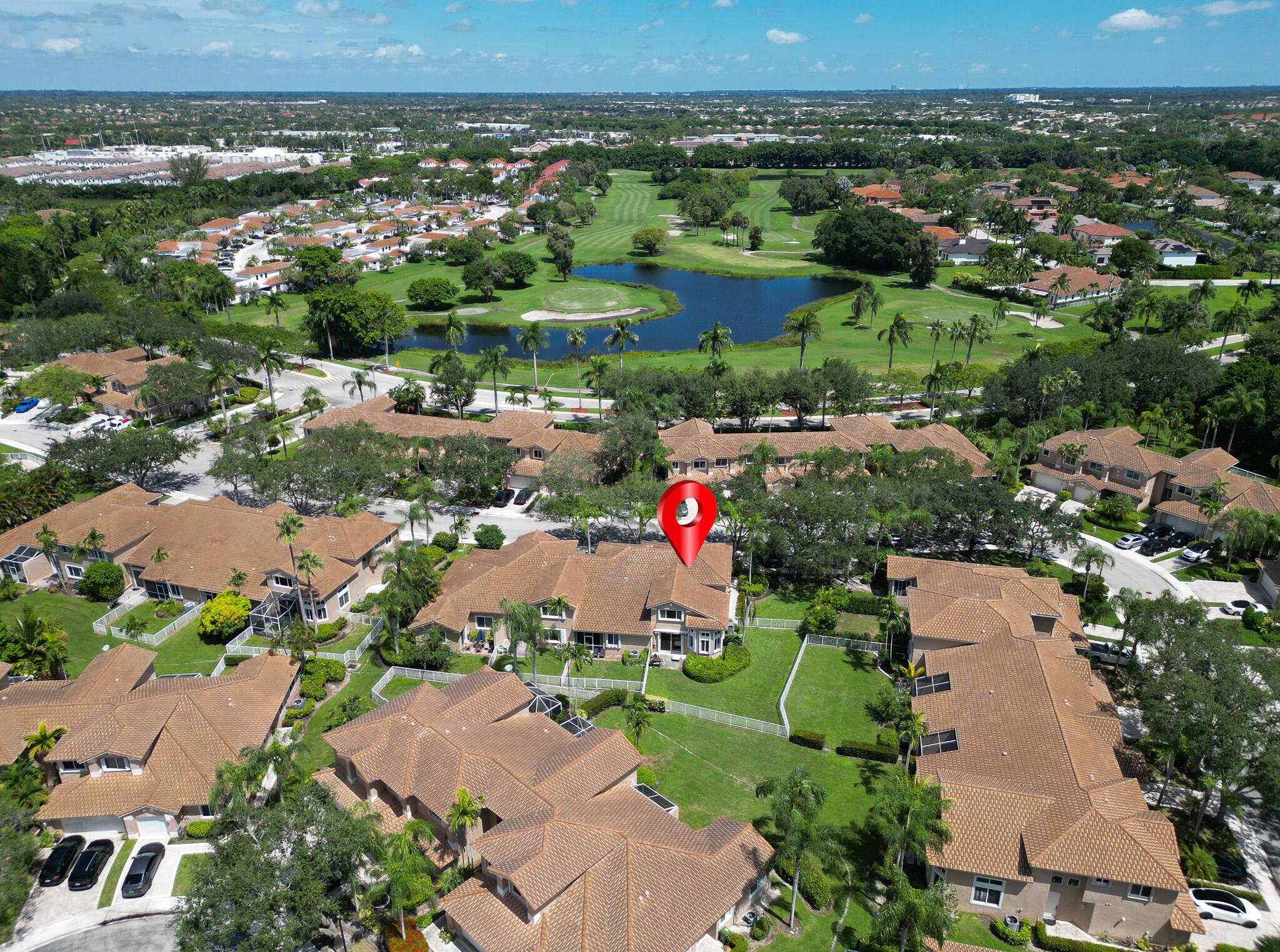Discover this beautiful corner lot townhouse in the sought after Grand Palms Golf and Country Club, offering the elegance of country club living without mandatory membership fees. The spacious open concept design features high ceilings, abundant natural light, and welcoming living areas. The modern kitchen is complete with stylish cabinetry, polished countertops, and stainless steel appliances ideal for home cooks and entertaining. The primary suite includes a walk-in closet and a well-appointed bathroom. As a corner unit, this home provides enhanced privacy, expansive windows, and a bright, airy atmosphere. Grand Palms is a gated, meticulously maintained community with golf course views, walking walking paths, and lush landscaping.