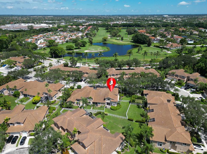 Discover this beautiful corner lot townhouse in the sought after Grand Palms Golf and Country Club, offering the elegance of country club living without mandatory membership fees. The spacious open concept design features high ceilings, abundant natural light, and welcoming living areas. The modern kitchen is complete with stylish cabinetry, polished countertops, and stainless steel appliances ideal for home cooks and entertaining. The primary suite includes a walk-in closet and a well-appointed bathroom. As a corner unit, this home provides enhanced privacy, expansive windows, and a bright, airy atmosphere. Grand Palms is a gated, meticulously maintained community with golf course views, walking walking paths, and lush landscaping.