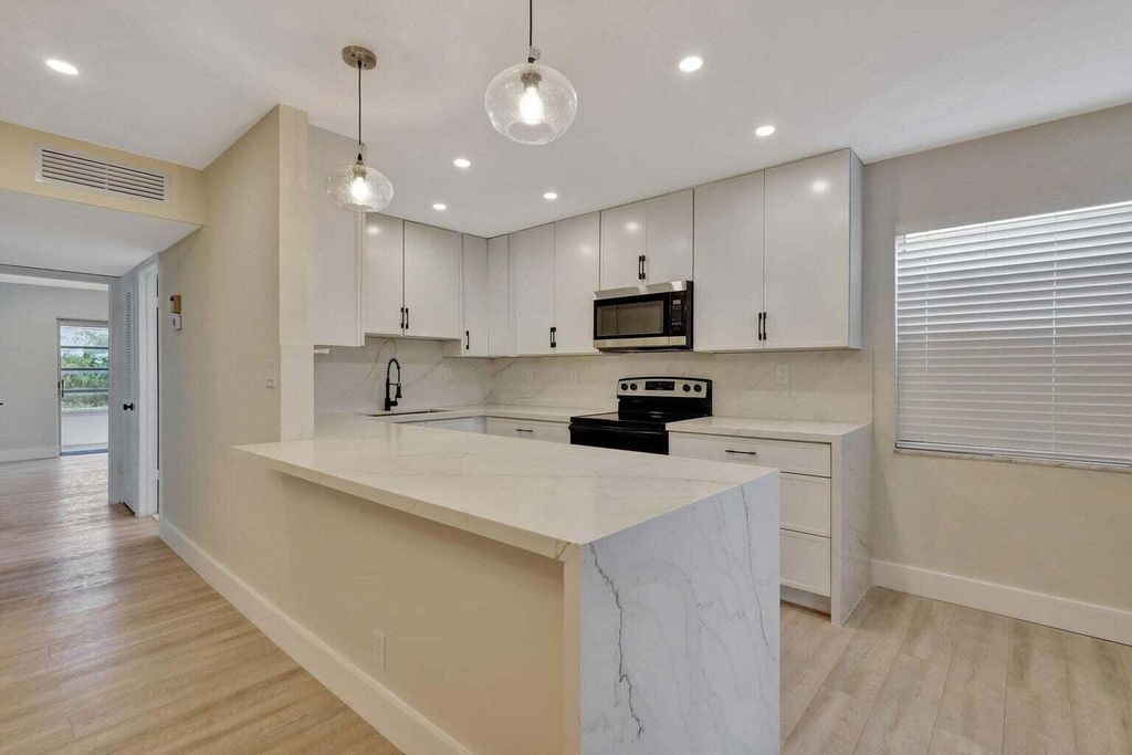 Photo of 802 BURGUNDY Q, Delray Beach, FL 33484 (MLS # B26055274)