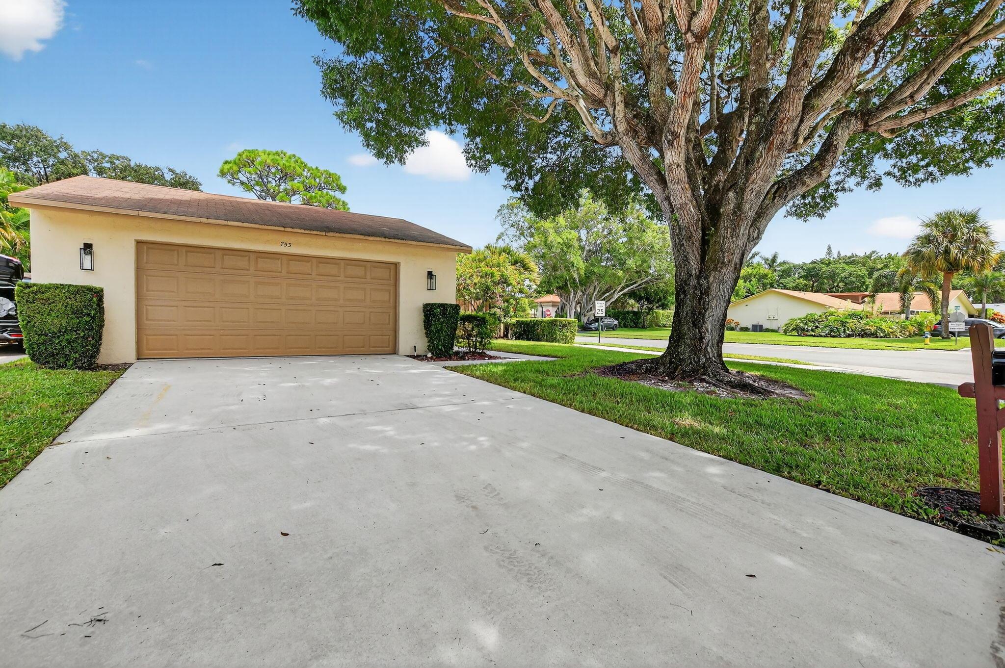 Totally remodeled single-family home in the sought-after gated community of Rainberry Bay! This light-filled residence features brand new large porcelain tile floors throughout, a stunning new kitchen with quartz counters, custom backsplash, and updated bathrooms. Enjoy peace of mind with a roof maintained by the HOA, an A/C replaced in 2021, and plantation shutters on most windows. The home offers a spacious Florida room, a two-car garage, and a large fenced yard--perfect for relaxing or entertaining. Rainberry Bay is pet friendly (2 pets, up to 30 lbs each) and offers a vibrant lifestyle with incredible amenities, all just minutes from Downtown Delray and the beach!