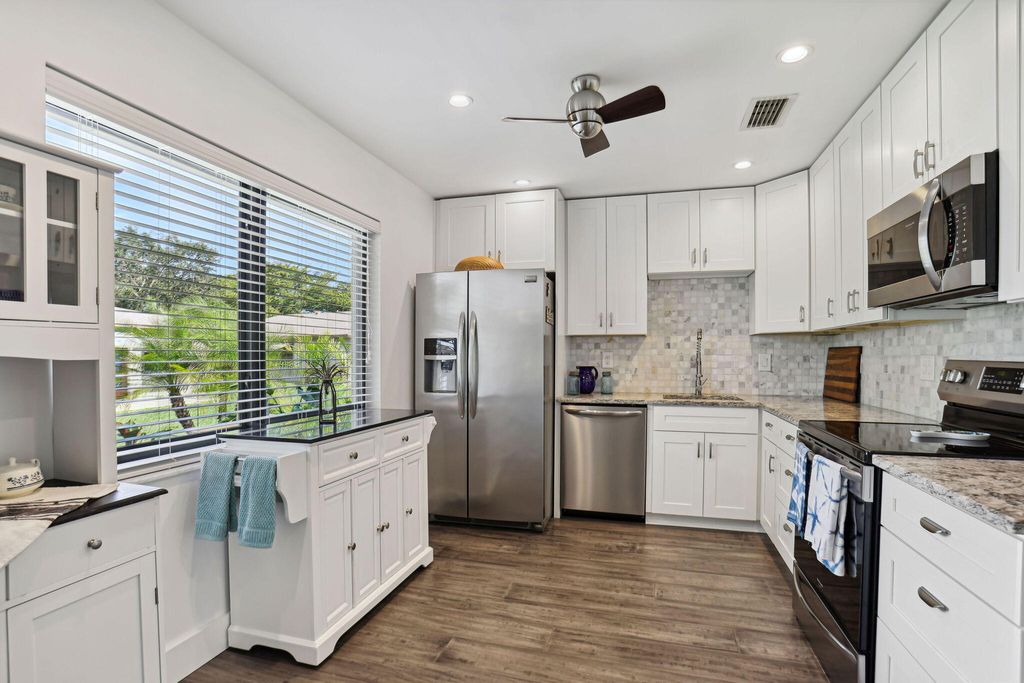 Photo of 1563 Palmland Drive, Boynton Beach, FL 33436 (MLS # R10960215)