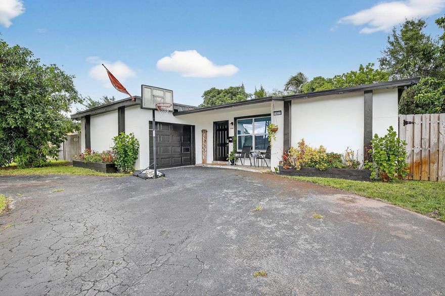 Beautifully updated 3BR/2BA No HOA, single-family home with flex space and 1-car garage.  Enjoy peace of mind with a new roof (2022), AC (2021), and water heater (2021). Modern kitchen and bathrooms, granite countertops, and stainless steel appliances.Relax or entertain in the fully fenced backyard with a partially in-ground pool. Convenient Sunrise location close to shops, dining, and highways.