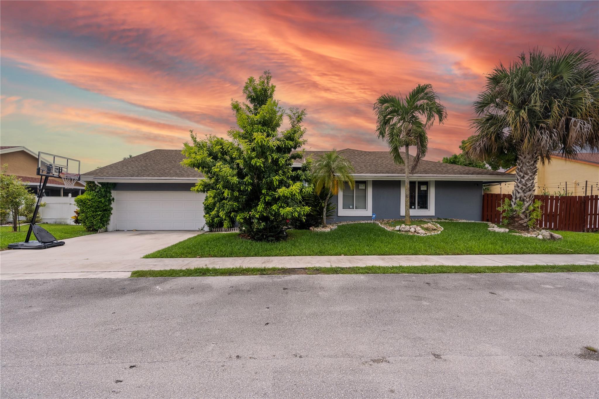 Imagine living in this beautifully remodeled 4-bedroom, 3-bath POOL home with NO HOA, thoughtfully designed for both comfort and style. The spacious kitchen is the heart of the home, featuring a massive island perfect for family gatherings and holiday memories, newer high-end stainless steel appliances, ample storage, and a brand-new pantry. Step outside to your private backyard oasis, complete with tropical fruit trees, a sparkling tiled pool, and the privacy of a fully fenced yard. Additional upgrades include a full-house generator, newer water heater, updated bedroom flooring, and impact windows and doors. A newly installed skylight fills the home with natural light, creating a bright and welcoming atmosphere throughout. Unbeatable location, near major access roads & entertaining spots