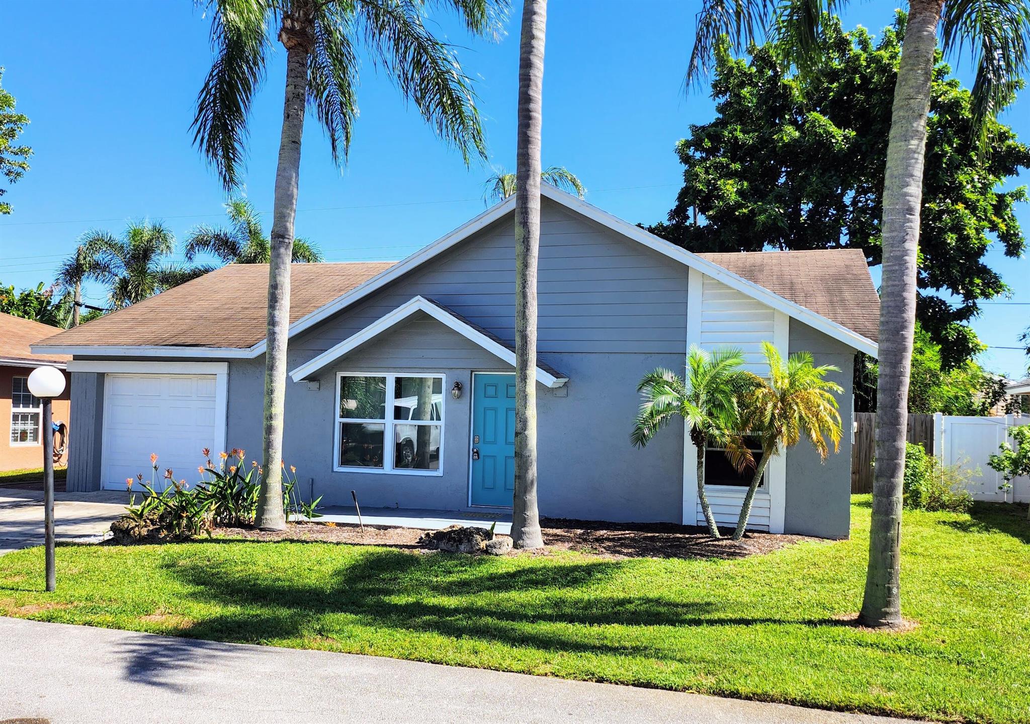 LOCATION, LOCATION, Recently updated villa style 3-Bed/2-Bath/1-car garage home is centrally located-close to everything you would ever need just minutes to Downtown Delray Beach, Atlantic Ave. Open layout with vaulted ceilings, freshly painted throughout, Brand New HVAC system, newer countertops, stainless steel kitchen appliances, and brand new light-wash waterproof luxury vinyl flooring throughout, updated bathrooms, Brand New Washer/Dryer in laundry room with plenty of storage throughout the entire home. Home also includes newer hurricane impact windows & slider, smaller driveway (2 cars) Garage is air-conditioned can be used as office/den/studio/Etc. Full fenced, private backyard with open patio. Pets allowed on case-by-case basis.