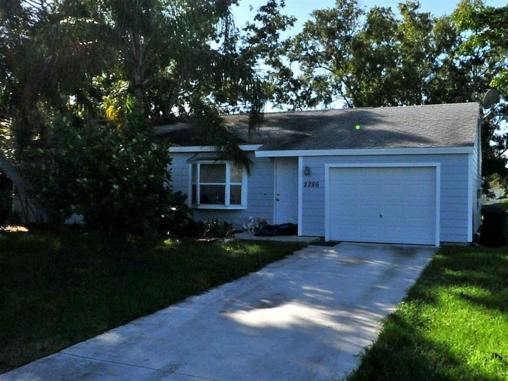 Photo of 2286 SE Braddock Street, Port Saint Lucie, FL 34952 (MLS # R10722978)