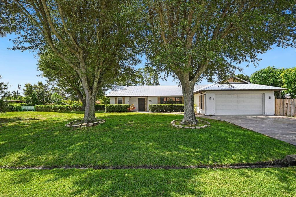 Photo of 350 NE Gulfstream Avenue, Port St Lucie, FL 34983 (MLS # R10905056)