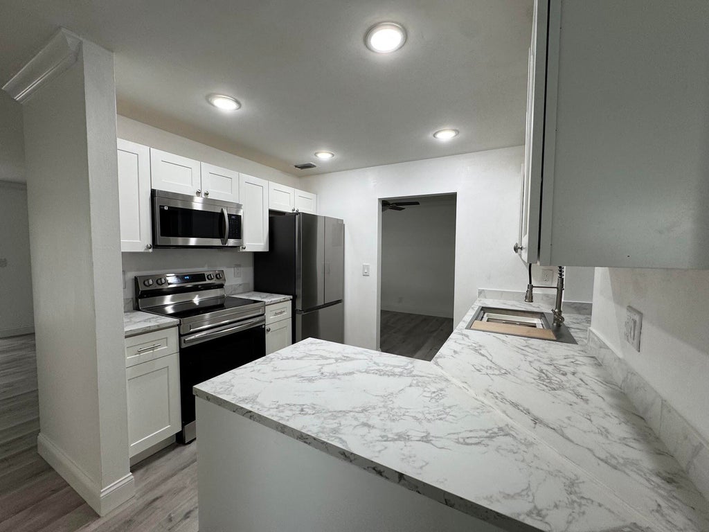 Photo of 1331 W Campanelli Drive, Plantation, FL 33322 (MLS # B26061750)
