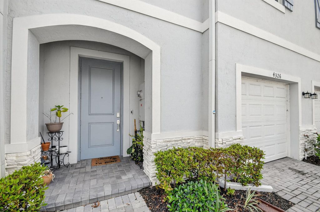 Photo of 4326 Hammock Grove Dr, Lake Worth, FL 33467 (MLS # B26000156)