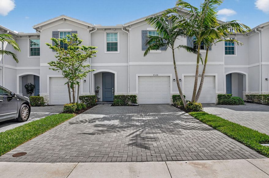 Experience modern luxury in the heart of Lake Worth! Built in 2023, this pristine 1,851 sqft smart home in Lakeshore at The Fountains offers the perfect blend of style and security. This two-story townhouse features 4 spacious bedrooms and 2.5 baths, highlighted by a stunning white kitchen with premium stainless steel appliances. Complete with impact windows, a 1-car garage, and a rare 4-car driveway, this home is designed for convenience. The gated community provides resort-style amenities, including an onsite swimming pool with a cabana and a playground for residents to enjoy. Perfectly positioned for an active lifestyle, you are just minutes from PBI Airport and major transport hubs, offering seamless access to the best beaches, dining, and shopping in Palm Beach County.