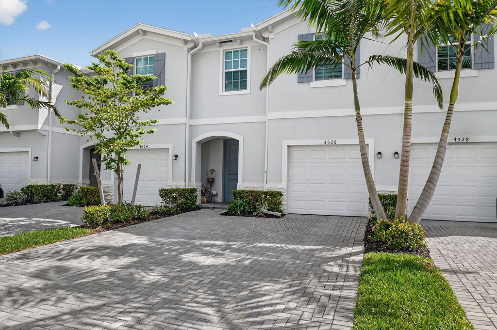 Photo of 4326 Hammock Grove Dr, Lake Worth, FL 33467 (MLS # B26000156)