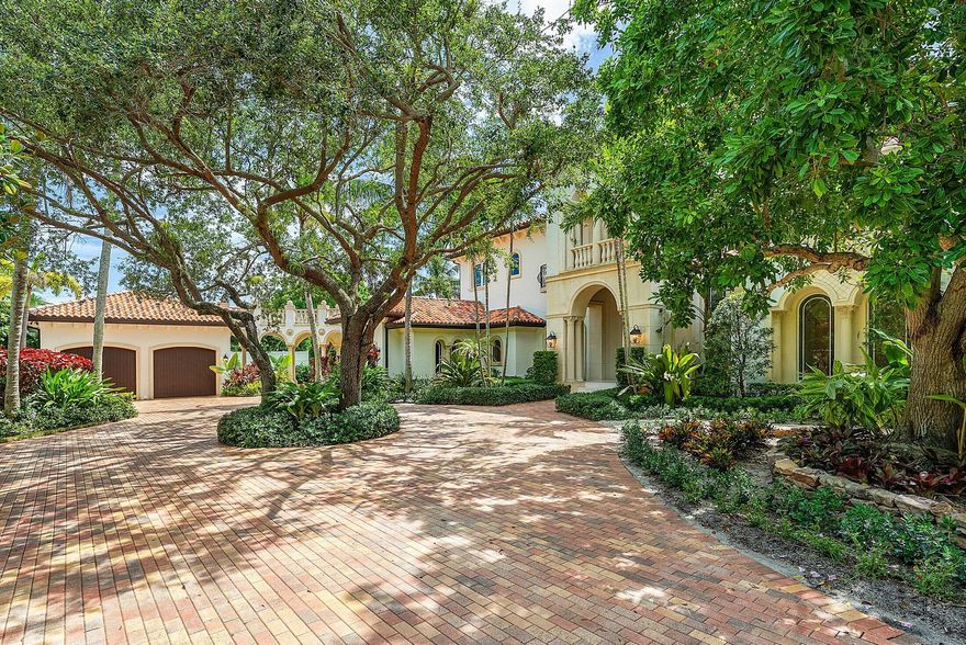 Situated at the end of a quiet cul-de-sac in East Delray's highly coveted Lake Ida neighborhood, this extraordinary custom estate presents a rare opportunity to enjoy uncompromising privacy, architectural excellence, and proximity to all the best of downtown and the beach. Enclosed behind independent gates on a lushly landscaped .57-acre lot, the home offers 7,019 square feet under air and nearly 10,000 total square feet of meticulously designed living space. Every element of the property reflects an ambitious and comprehensive renovation executed by a top-tier Palm Beach team, who reimagined the residence with a refined blend of elegance, comfort, and cutting-edge systems for modern living.

The grand two-story residence includes seven ensuite bedrooms, seven full and two half baths, and a thoughtful array of bonus spaces such as a gym, salon and makeup suite, wellness room, butler's pantry, and an elevator. Oversized hurricane-impact windows and doors invite natural light throughout, illuminating the rich finishes and carefully layered textures. Main living spaces are wrapped in imported 48x48 Marca Corona porcelain tile, while the dramatic foyer showcases an inlaid white oak design and a statement spiral staircase with custom railings. With an eye for both form and function, the home also includes Control4 automation, Lutron lighting, sound-insulating drywall, five new HVAC units, and a whole-house 50 kW Generac generator with a buried 1,000-gallon propane tank.

At the heart of the home lies a showstopping double-island kitchen anchored by Cristallo quartzite countertops, custom cabinetry, a hand-fired clay backsplash from Italy, and a full suite of Wolf, Sub-Zero, and Miele appliances. A separate butler's kitchen offers an additional cooking station, ideal for catering or entertaining on a grand scale. The dining room, anchored by arched entryways and a sleek wet bar, sits adjacent to a spacious great room with coffered ceilings, motorized shades, and a gas fireplace clad in marble.

The primary suite is its own private retreat, with French doors opening to a covered loggia, dual custom closets with LED-lit glass inlays, and a luxurious wellness wing complete with a salon, makeup studio, coffee bar, and flexible space for a spa, nursery, or sitting area. The ensuite bath evokes spa-level luxury with a 10.5' wet room featuring Dornbracht rain showers, Aquapressure massage jets, a soaking tub, Cristallo countertops with integrated sinks, and richly veined imported tile from Italy.

Outside, the property feels like a private resort, with a saltwater pool and spa, updated equipment, putting green, and a fully equipped summer kitchen. The spacious loggia offers outdoor lounging and dining areas, a TV, and fans for year-round comfort. Additional highlights include a three-car garage, upstairs mechanical room, dual cabana baths, a first-floor guest suite with private loggia and entrance, and multiple balconies.

This one-of-a-kind estate offers the ultimate in sophistication and convenience for buyers seeking a move-in-ready home east of Lake Ida, where privacy, scale, and quality converge just minutes from Delray's vibrant downtown, Atlantic Avenue, and pristine beaches.

***Please note: Photos with furnishings are virtually staged for illustrative purposes.***

The information published and provided including but not limited to prices, measurements, square footages, lot sizes, features, finishes, and calculations are subject to errors, omissions or changes without notice.  All such information should be independently verified.  All parties should perform their own due diligence to verify all information.