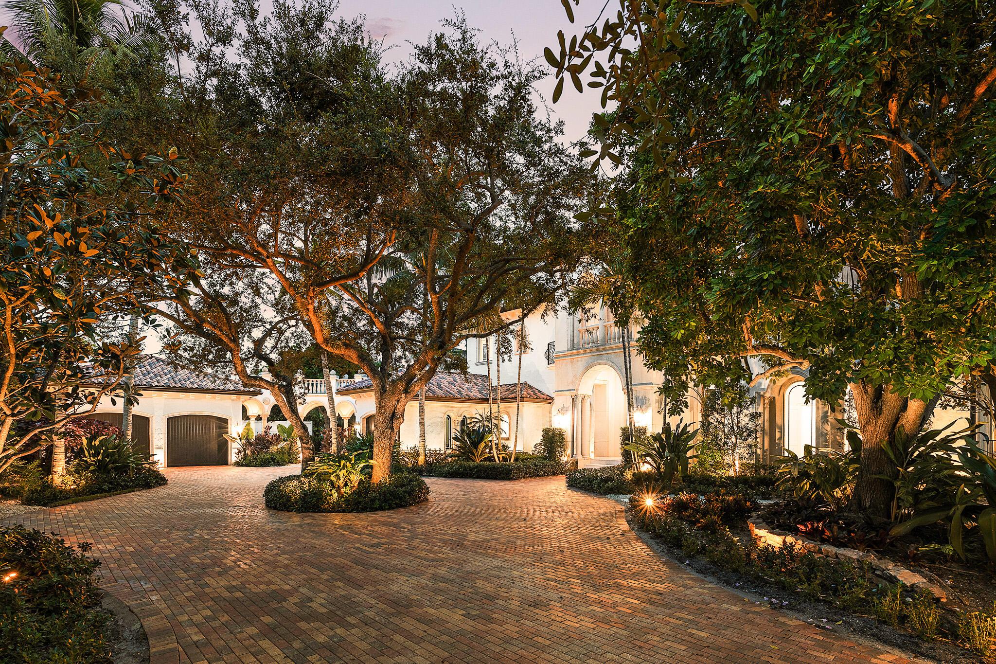 Situated at the end of a quiet cul-de-sac in East Delray's highly coveted Lake Ida neighborhood, this extraordinary custom estate presents a rare opportunity to enjoy uncompromising privacy, architectural excellence, and proximity to all the best of downtown and the beach. Enclosed behind independent gates on a lushly landscaped .57-acre lot, the home offers 7,019 square feet under air and nearly 10,000 total square feet of meticulously designed living space. Every element of the property reflects an ambitious and comprehensive renovation executed by a top-tier Palm Beach team, who reimagined the residence with a refined blend of elegance, comfort, and cutting-edge systems for modern living.The grand two-story residence includes seven ensuite bedrooms, seven full and two half baths,