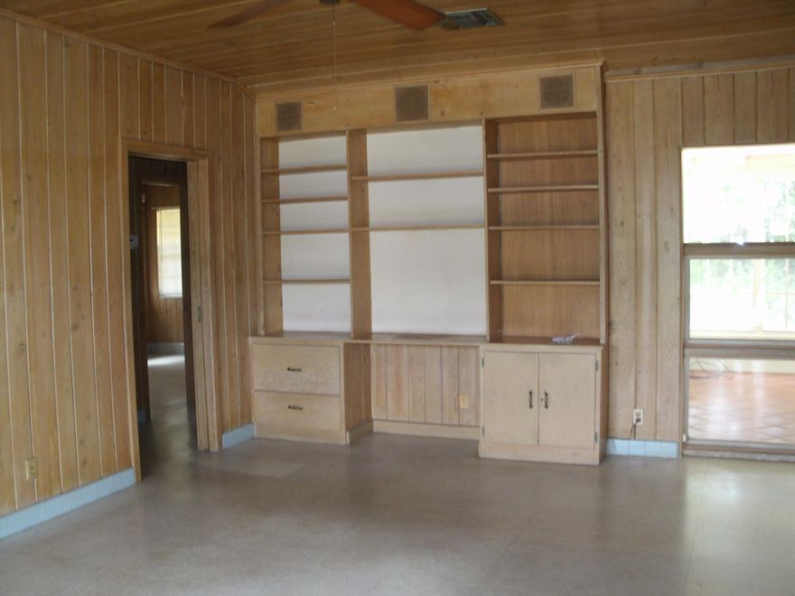 COZY CLASSIC FLORIDA HOME LOCATED IN DESIRABLE NEIGHBORHOOD , PRIVATE BACKYARD , FLORIDA ROOM WITH FIREPLACE , CARPORT , CLOSE TO SHOPPING AND EASY ACCESS TO I-95