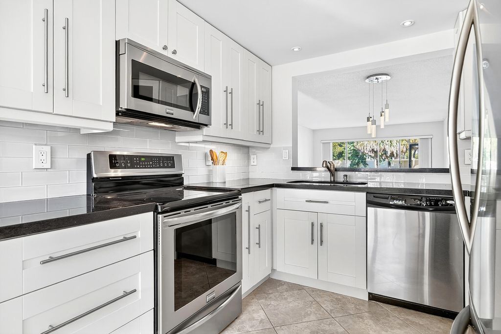 Photo of 5021 Oak Hill Lane #115, Delray Beach, FL 33484 (MLS # B26009949)