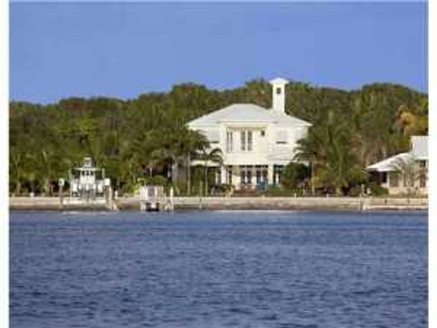 North Atlantic Drive, Hypoluxo Island, Lantana, Florida.  Directly on the Intracoastal Waterway, this rare property resides on Hypoluxo Island, a lush barrier island sought after for its Old Florida serenity, protected deepwater dockage, and choice Gold Coast location in between Palm Beach and Boca Raton.  Just across the bridge are the pristine Atlantic Ocean beaches of Manalapan.  PUBLIC REMARKS CONTINUED IN ADDENDA...The information herein is deemed reliable and subject to errors, omissions or changes without notice. The information has been derived from architectural plans or county records. Buyer should verify all measurements.  The lot to the north of the property is also available for purchase - See RX-10040408.