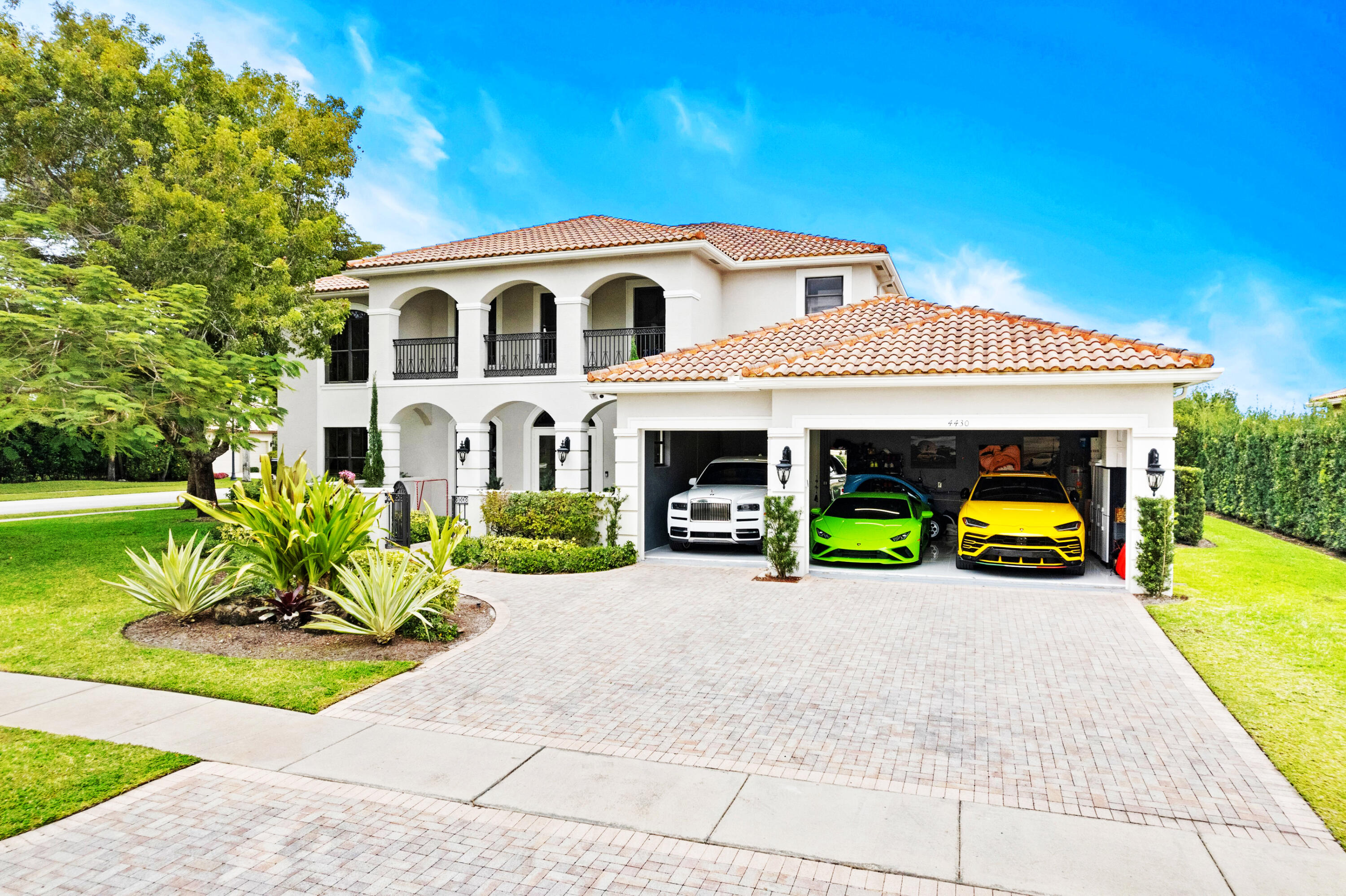 Discover an unparalleled standard of living in this estate home, nestled within the exclusive and gated community of The Estates at Isles At Wellington. Available Unfurnished / Annual term. This expansive 6-bedroom, 4.5-bathroom occupies a sprawling 15,059 sq ft corner lot. The desirable split floor plan, featuring ceramic tile floors throughout the first level common areas, is perfect for both entertaining and everyday living. The sizable gourmet kitchen is a chef's delight, boasting 42-inch white cabinetry, granite countertops, a KitchenAid refrigerator, wall oven, microwave, and a glass cooktop. Enjoy elegant dinners in the formal dining room or relax in the open family room. The first-floor master suite is a private sanctuary, offering a spa-like ensuite with a steam shower,
