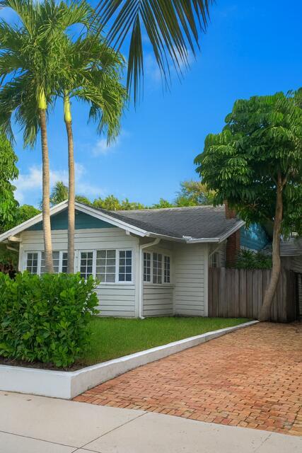 Historic Charm Meets Modern Comfort! Live in one of West Palm Beach's most desirable neighborhoods in this stunning 1924 bungalow, blending timeless architectural character with modern upgrades. Located in the historic Grandview Heights district, this home offers the perfect mix of charm, convenience, and lifestyle--just steps to CityPlace, the Norton Museum, downtown dining, and a short drive to the beach. Inside, are 1,500 sq. ft. of beautifully renovated living space. Original hardwood floors, impact doors, and skylights bring warmth and natural light throughout. The updated kitchen and appliances (including wine fridge) make cooking and entertaining easy, while the newly installed HVAC ensures year-round comfort. A full alarm system with video cameras provides added peace of mind.