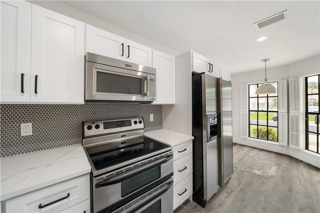 Photo of 10300 W Hidden Springs Ct #10300, Boca Raton, FL 33498 (MLS # F10385707)