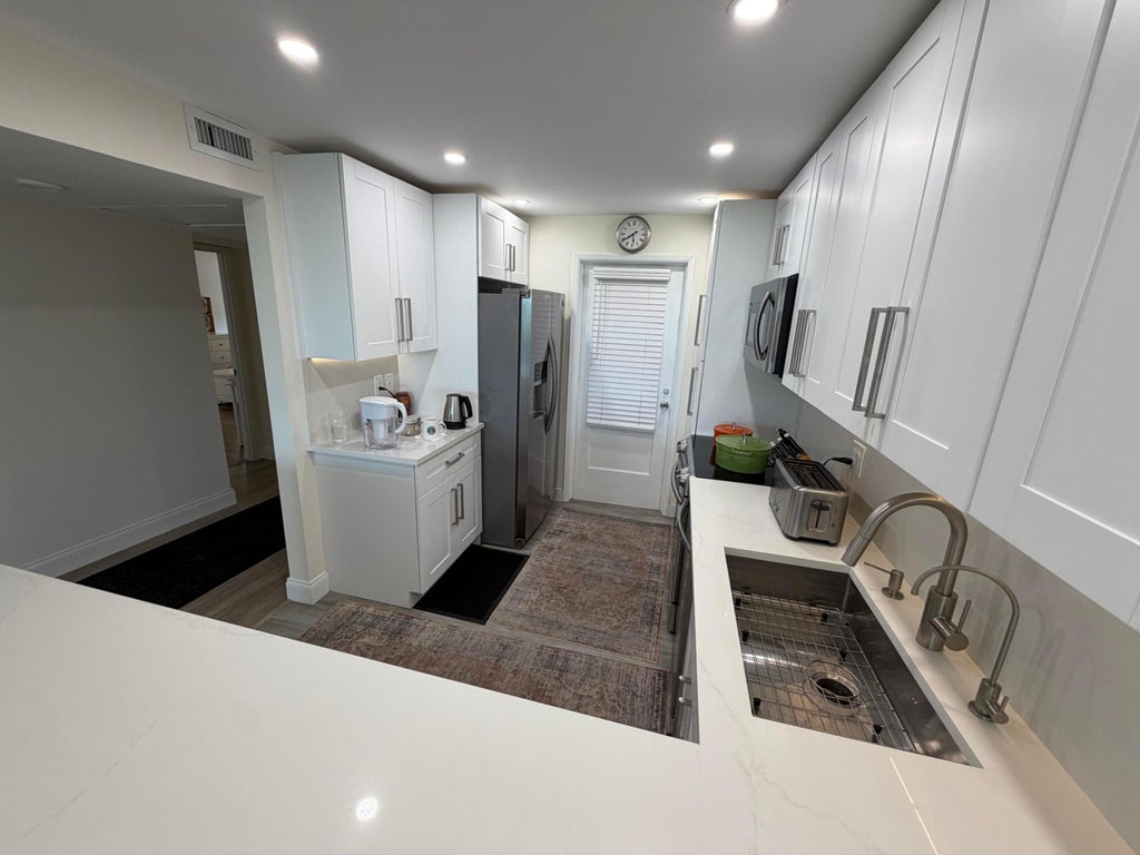 Photo of 3001 S Course Drive #501, Pompano Beach, FL 33069 (MLS # B26050316)