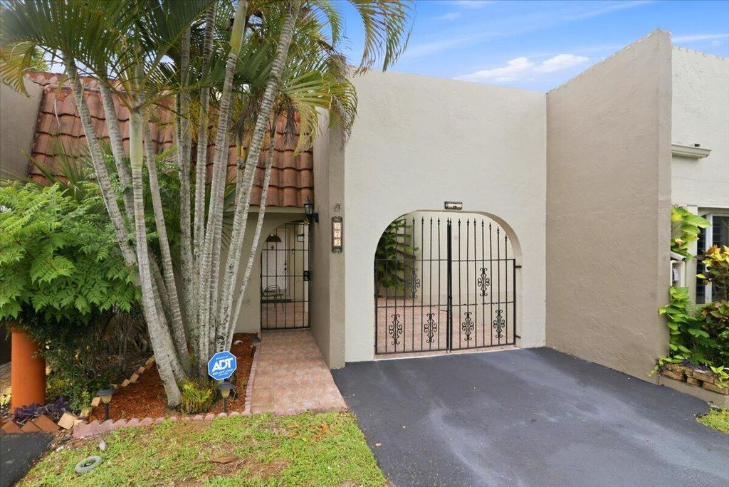 Photo of 275 Jacaranda Drive, Plantation, FL 33324 (MLS # B26037538)