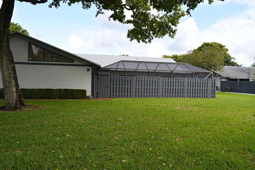 Beautifully renovated villa with privacy fence and screened courtyard.  This residence features a modern interior with new kitchen and bathrooms. Love the outdoors? Enjoy this oversized screened private courtyard which is ideal for entertaining.  Unit is tiled throughout.  Great location.  Ready for move-in.  Association approval required.