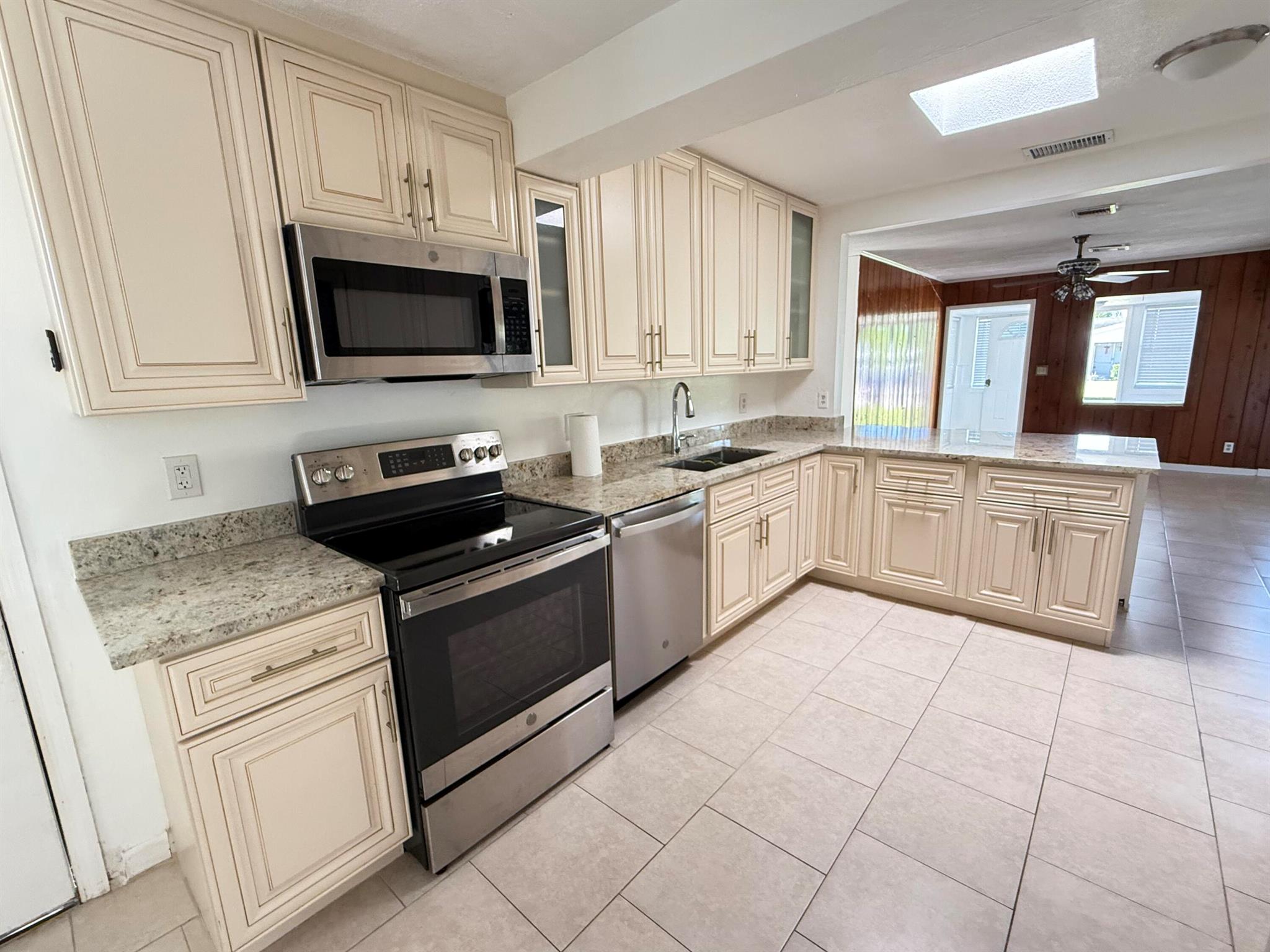 All ages, bright 2/2 Single Family Home, freshly painted, SS appliances, washer & dryer inside, central A/C, granite countertops, foyer room, spacious living area, eat in kitchen, sky light window in kitchen, tiles through out the house and a huge backyard.