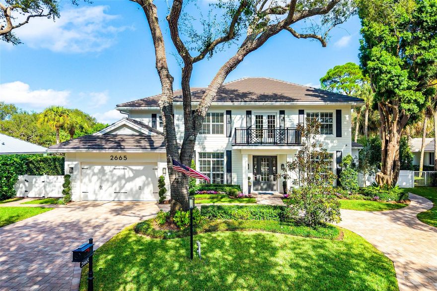Sophisticated, timeless, and completely transformed, this elevated colonial with modern finishes is located in the coveted gated community of Andover in Delray Beach. Offering 4 bedrooms, a beautifully designed club room, and a private office, this home has been curated with exceptional craftsmanship and thoughtful detail throughout.

Situated on a quiet cul-de-sac surrounded by mature oak trees, the home immediately captivates with its classic black-and-white façade, elegant symmetry, and beautifully manicured grounds. Inside, the welcoming entry features a striking staircase with modern iron railings and warm wood accents—setting the tone for the home’s perfect blend of traditional charm and contemporary sophistication.
