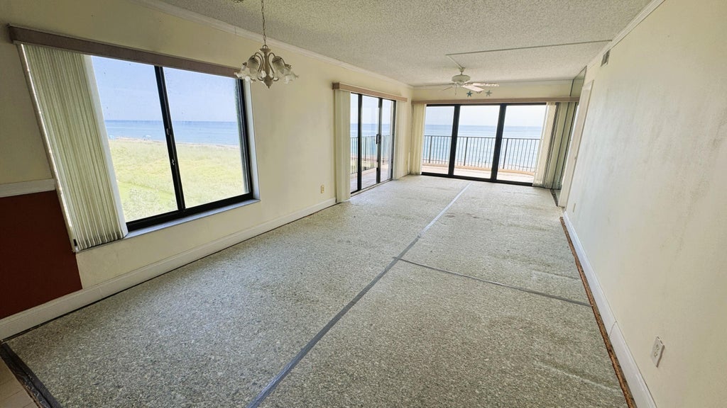 Photo of 10310 S Ocean Drive #301, Jensen Beach, FL 34957 (MLS # B26044216)