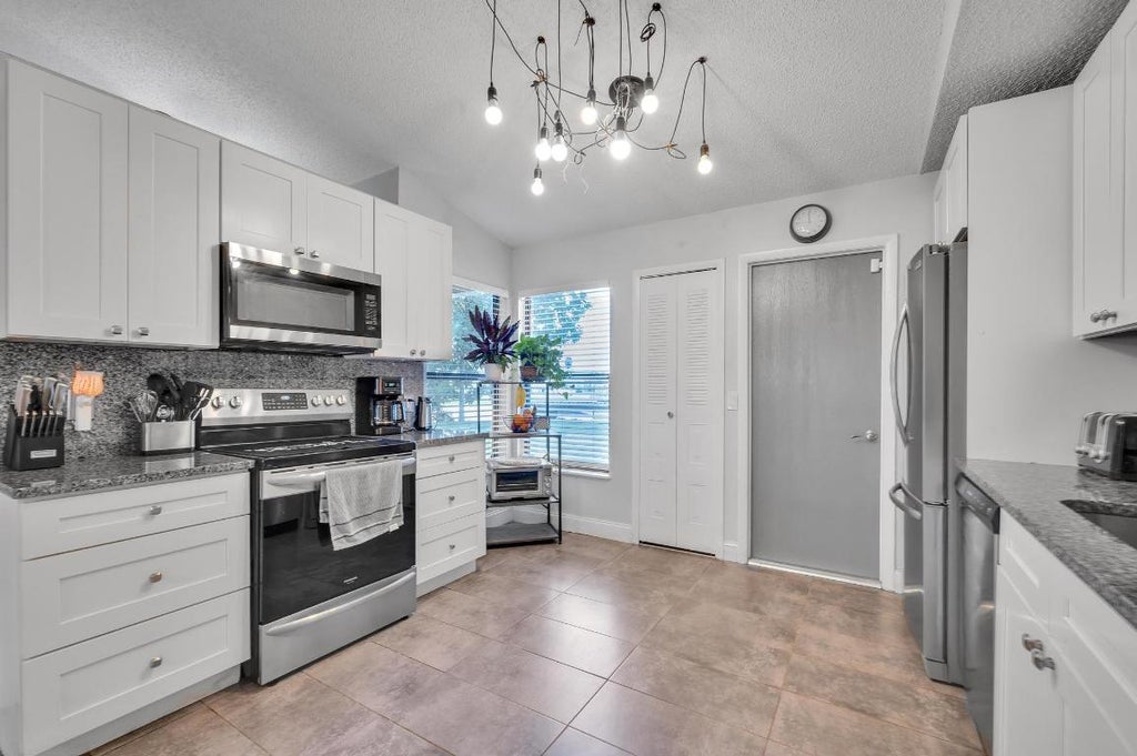 Photo of 3197 SW Esperanto Street, Port Saint Lucie, FL 34953 (MLS # R10935932)