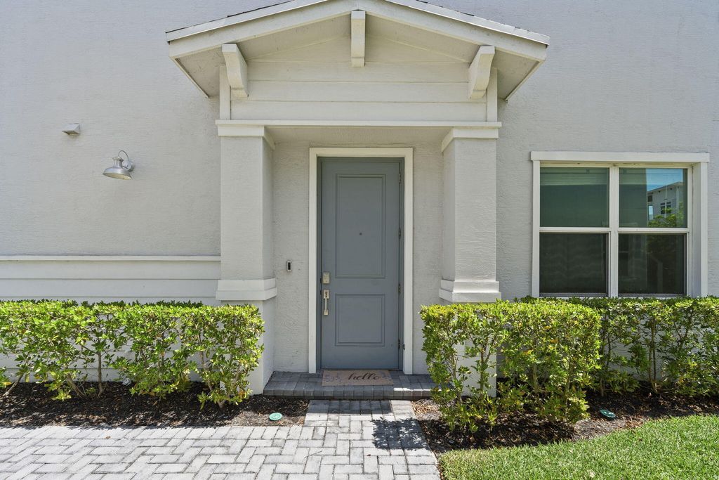 Photo of 840 SE Grovebush Lane, Port Saint Lucie, FL 34984 (MLS # B26027784)