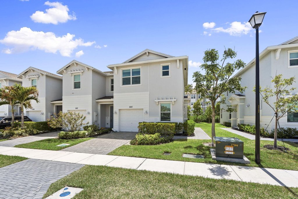 Photo of 840 SE Grovebush Lane, Port Saint Lucie, FL 34984 (MLS # B26027784)