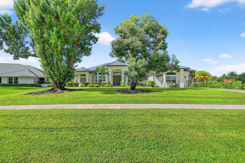 Photo of 15830 Meadow Wood Drive, Wellington, FL 33414 (MLS # R11125260)