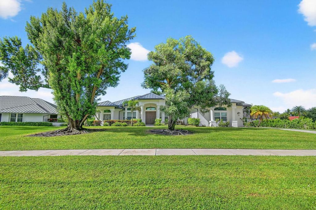 Photo of 15830 Meadow Wood Drive, Wellington, FL 33414 (MLS # R11125260)