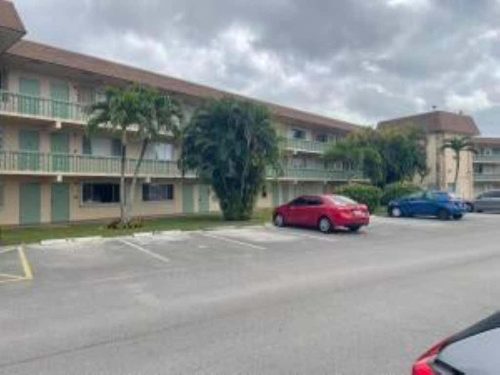 Photo of 400 Village Green Circle W #202, Palm Springs, FL 33461 (MLS # B26061308)