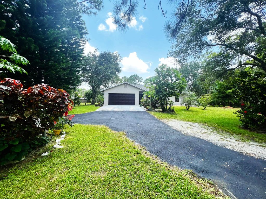 Photo of 12736 Orange Boulevard, West Palm Beach, FL 33412 (MLS # R10904489)